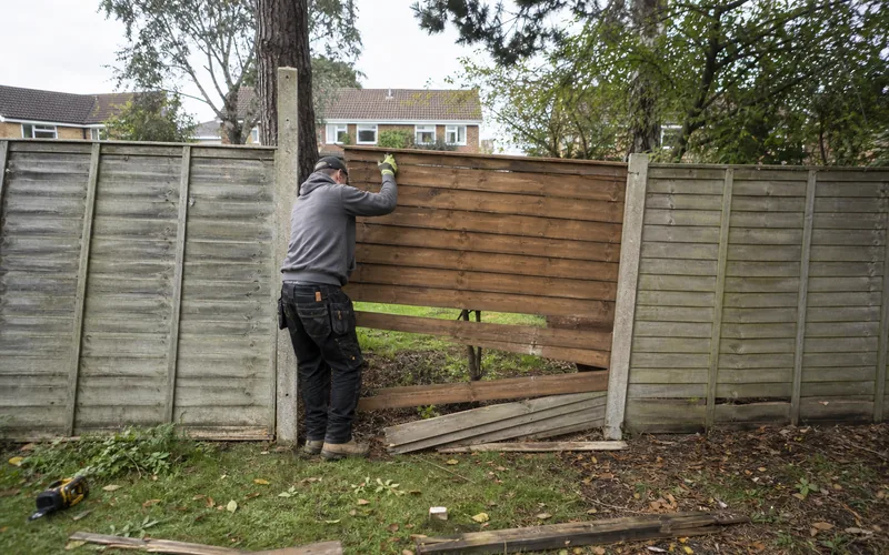 Fence repair work on a storm-damaged boundary in Chesterfield